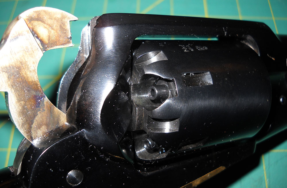 detail, back of Pietta 1858 cylinder with hammer at half-cock, showing safety notches
